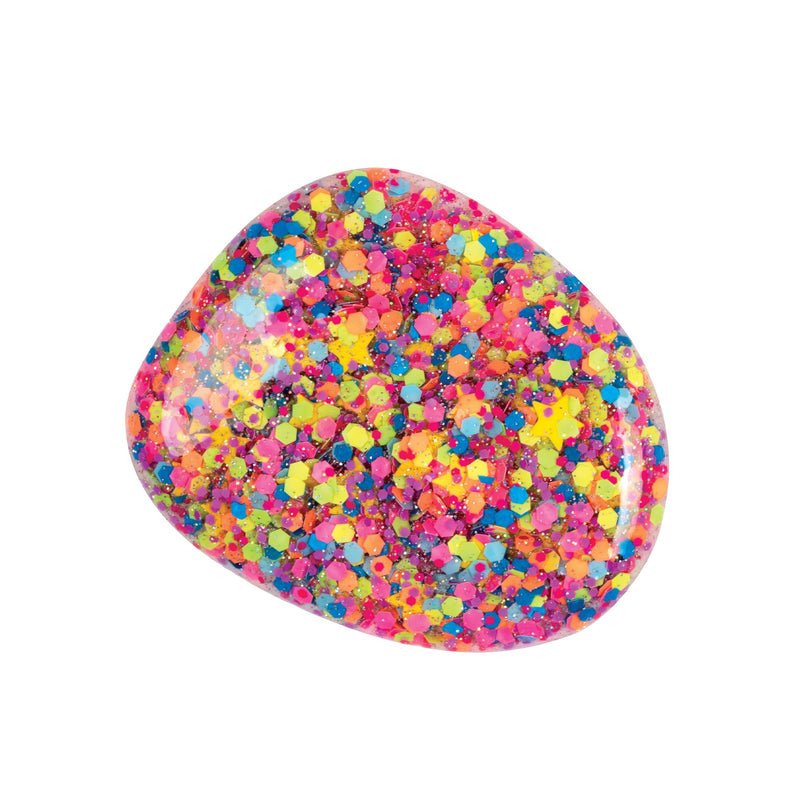 A swatch from the hits the spot nail polish is a transparent sparkling confetti polish topper full of tiny dots of different colors like blue, yellow, green, pink, purple, orange, and some yellow stars.