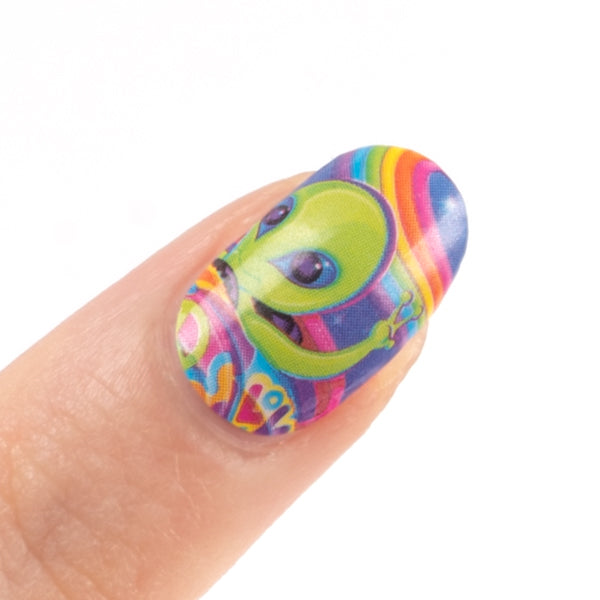One fingernail with the nail wrap that shows the character  Zorbit™ with a rainbow at the back.