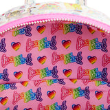 Holographic Mini Backpack from the inside displays an all-over print of Lisa Frank’s logo, whit some rainbow hearts on a pink background.