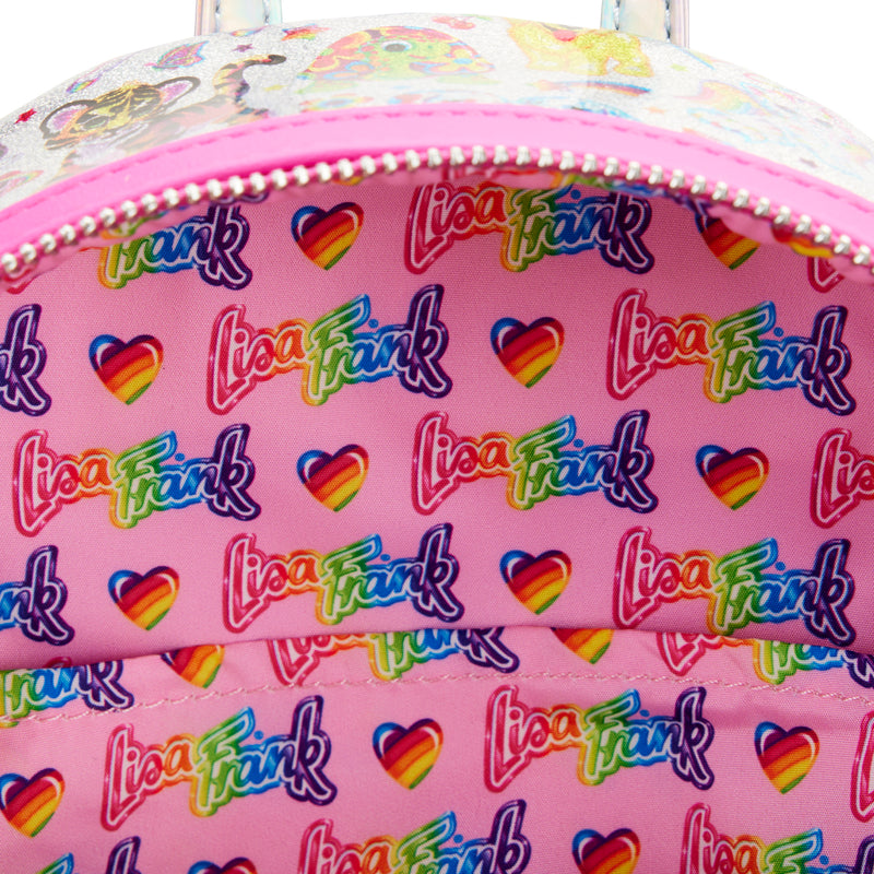 Holographic Mini Backpack from the inside displays an all-over print of Lisa Frank’s logo, whit some rainbow hearts on a pink background.