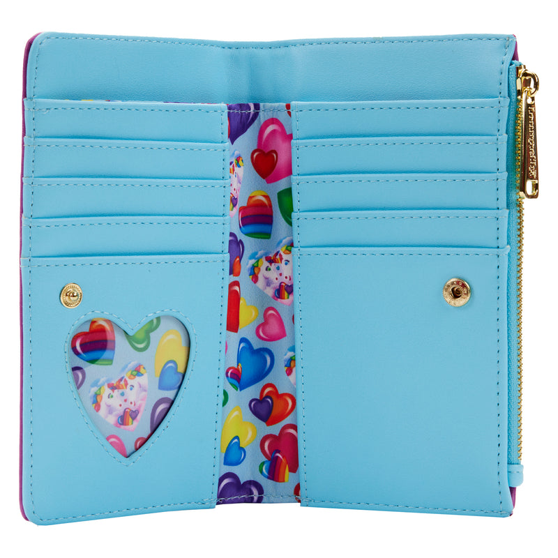 The inside contains 7 slots for holding cards and a clear slot with a heart shape, all in blue, and it has a fabric on the inside with hearts of different colors, some of them with Markie and Celeste.
