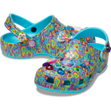 Kids´ classic Lisa Franck clog, each shoe is decked out in signature Lisa Frank designs with colorful hearts on a blue background and includes a whimsical and wonderful collection of Jibbitz™ charms like the heart with the word love with the Lisa frank colors, a butterfly, a purple, green, pink and blue diamond and a happy flower.