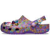 Classic Lisa Franck Crocs view from the right side each shoe is decked out in signature Lisa Frank designs with colorful hearts on a purple background and includes a whimsical and wonderful collection Jibbitz™ charms like the piece and love sine with the lisa frank colors, a flower, a butterfly, a red, purple and blue diamond and the word groovy in different colors, and a love charm.