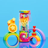 Lisa Frank Tye Dye BlendJet 2 portable blender with a tye dye circular pattern with the colors pink, yellow, green, blue, and purple; with the blend button, the cap in the same pattern, with a little plastic pink strap on the right side, inside the blender there different kinds of fruit, on the side of the product there are some decoration fruits like orange, melon and strawberries.